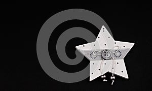 Christmas star with bow on black background