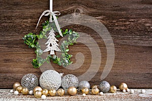 Christmas star with christmas balls on a wooden background. Christmas or New Year greeting card