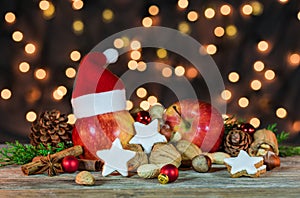 Christmas star cookies, red apples, nuts and spices