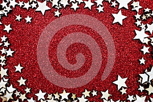 Christmas star frame over on red glitter background