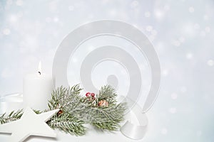 Christmas star and white candle