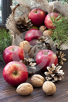 Christmas still life with apples and pine cones