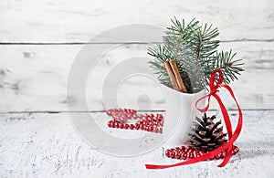 Christmas still life with branches of tree, pinecone and cinnamon