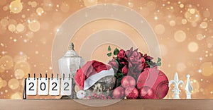 Christmas still life with calendar for year 2022 and home decoration gifts.