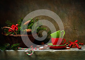 Christmas still life with cups and candy cane