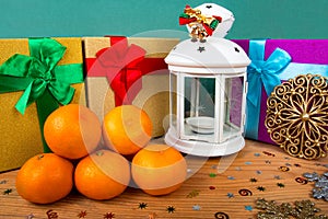 Christmas still life, tangerines, boxes with gifts, lantern, wooden background, Christmas background