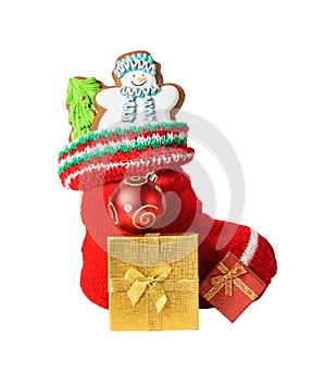 Christmas stocking with cookies, gifts and ball isolated