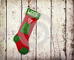 Christmas stocking for a dog against vintage wood