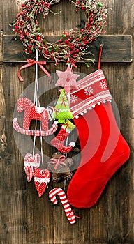 Christmas stocking and handmade toys hanging. Vintage decoration