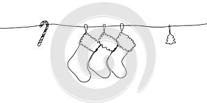 Christmas stockings, Christmas toys and candy one line art. Continuous line drawing of new year holidays, christmas