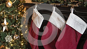 Christmas stockings hanging next to a tree