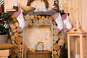 Christmas Stockings Hanging from Rustic Mantle photo