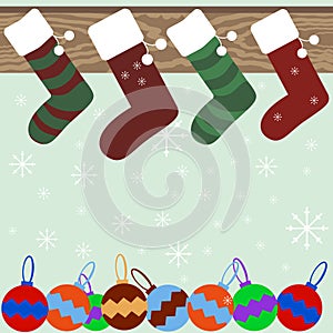Christmas stockings on mantel with snowflakes and Christmas ball