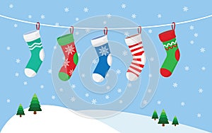 Christmas stockings for presents, hanging on a rope.