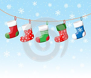 Christmas stockings in various colors on rope