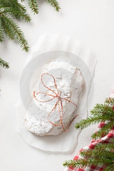 Christmas stollen - German bread on white background. Vertical format.