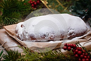 Christmas stollen its a Traditional Dresdner German Christmas cake Stollen with raising, berries and nuts. Powdered sugar is