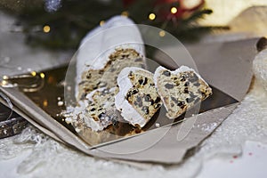 Christmas stollen, known in Germany as Christstollen, is a yeast bread. Christmas tradition with bokeh background