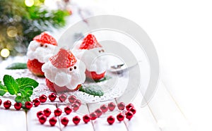 Christmas strawberry Santa. Funny dessert stuffed with whipped cream