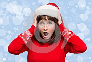 Christmas stress - busy woman wearing santa hat stressing for ch