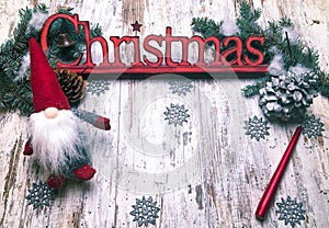 Christmas stuff: symbol, pine tree, newyear tree, santa, cone, candle, silver snowflakes on wood background