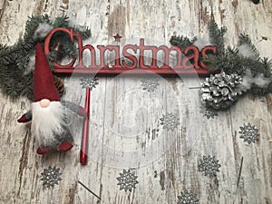 Christmas stuff: symbol, pine tree, newyear tree, santa, cone, candle, silver snowflakes on wood background