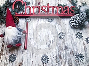 Christmas stuff: symbol, pine tree, newyear tree, santa, cone, candle, silver snowflakes on wood background