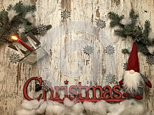 Christmas stuff: symbol, pine tree, newyear tree, santa, cone, candle, silver snowflakes on wood background