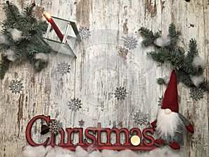 Christmas stuff: symbol, pine tree, newyear tree, santa, cone, candle, silver snowflakes on wood background