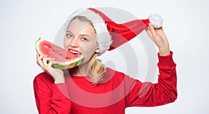 Christmas summer destinations. Woman santa hat hold slice watermelon. Prolong summer. Christmas girl eat watermelon photo