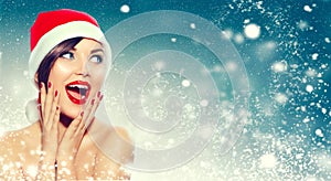 Christmas. Surprised woman in Santa`s hat