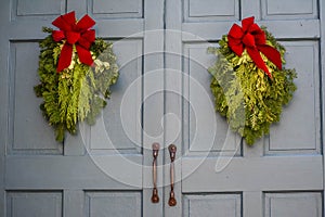 Christmas Swags Hanging on Gray Doors