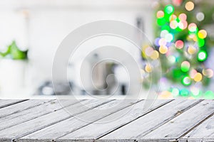 Christmas table background with christmas tree in kitchen out of focus. Background for display your products.