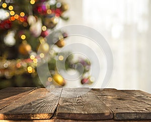 Christmas table background with christmas tree out of focus