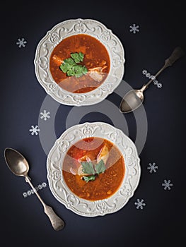 Christmas table with fish soup. Overhead view