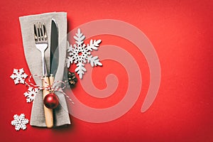 Christmas table place setting with knife, napkin and fork. Holidays new year background with copy space