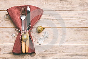 Christmas table place setting with knife, napkin and fork. Holidays new year background with copy space