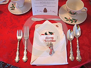 Christmas table place setting with ornate holiday decorations