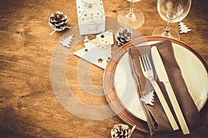 Christmas table place setting in vintage or rustic style.