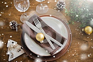 Christmas table place setting in vintage or rustic style.