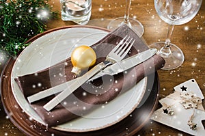 Christmas table place setting in vintage or rustic style.