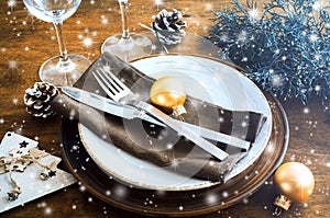Christmas table place setting in vintage or rustic style.