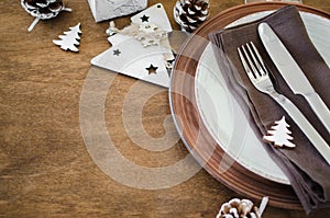 Christmas table place setting in vintage or rustic style