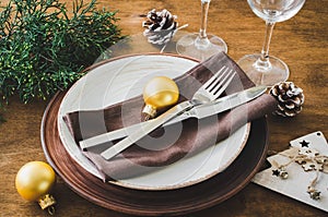 Christmas table place setting in vintage or rustic style