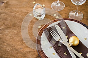 Christmas table place setting in vintage or rustic style