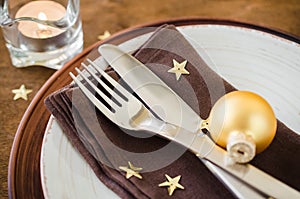 Christmas table place setting in vintage or rustic style