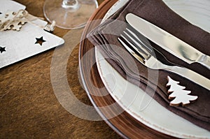 Christmas table place setting in vintage or rustic style