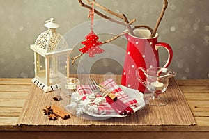 Christmas table setting with christmas decorations and candles