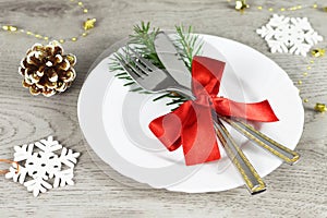 Christmas table setting. Christmas dinner plate and cutlery