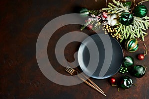 Christmas table setting with empty black plate